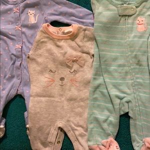 Three newborn cat themed pajamas